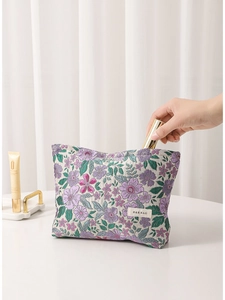 Floral embroidered makeup bag with vintage jacquard pattern and metal zipper closure