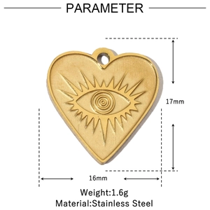 Macro detail of gold heart pendant featuring evil eye relief with size and weight specs