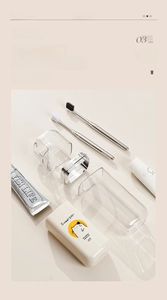 Macro view of portable travel toothbrush set with high-capacity cup and cat illustration