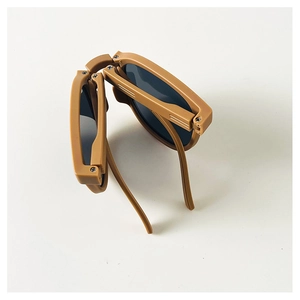 Foldable kids sunglasses with UV protection in matte caramel brown frame