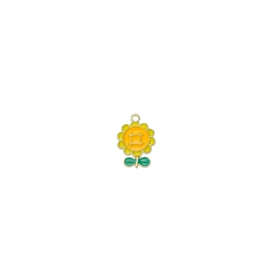Detail of sunflower pendant with yellow enamel petals and green leaf on white background