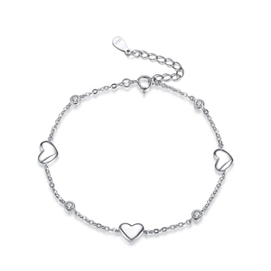 Macro shot of S925 sterling silver heart bracelet with cubic zirconia and beads