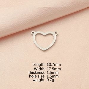 Silver hollow heart pendant with dual holes and dimensions 13.7x17.5mm on pink silk