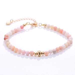 Pink and white natural stone beaded bracelet with gold plated heart charm and lobster clasp