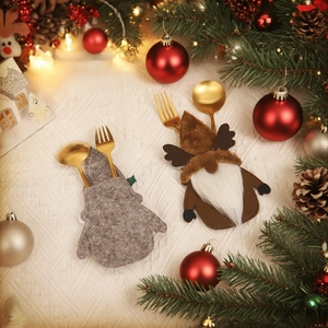 Christmas gnome cutlery holders set with reindeer patterns on a festive holiday table