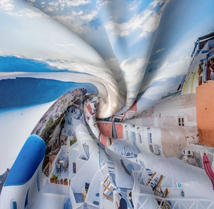 Detailed fabric texture of Santorini landscape tapestry with vivid blue and white print