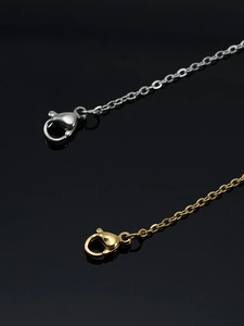 Close-up of gold and silver 18K plated stainless steel O-chains with lobster clasps