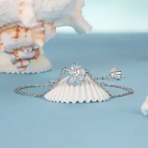 Romantic S925 sterling silver ocean charm bracelet featuring a blue conch stone and shell pendant