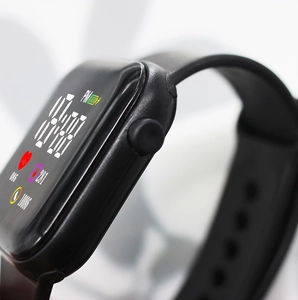 Macro side view of black square smart watch with digital health tracking display