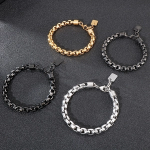 Detail of square link stainless steel bracelets in gold, silver, black, and gunmetal finishes