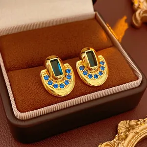 Vintage gold oval earrings with blue zircon stones in a classic royal palace style