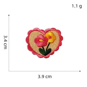 Macro shot showing dimensions of heart-shaped floral embroidery patch for phones and bags