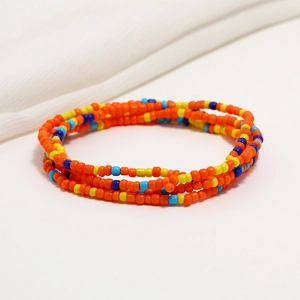 Detail of bohemian double-layered orange seed bead waist chain for beach bikini wear