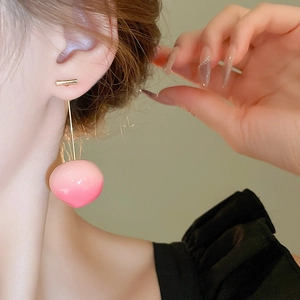 Sweet pink resin peach long dangle earrings for women worn on model during summer