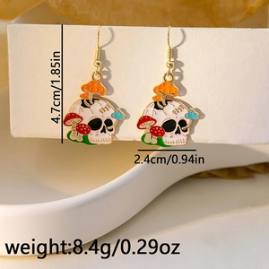 Detail view of skeleton mushroom enamel earrings with size and weight measurements