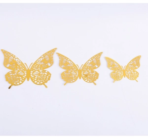 Detail view of gold 3D hollow butterfly wall stickers with intricate laser-cut patterns