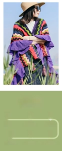 Close-up of bohemian knit shawl featuring colorful stripes, ruffles, and fringe details
