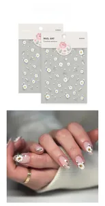 5D embossed daisy nail art stickers featuring white and green floral patterns with relief detail