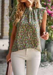 Detailed view of floral blouse with crew neck and ruffle short sleeves on a model