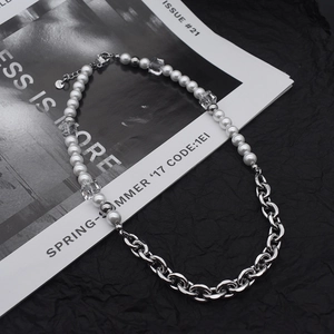 Square crystal pearl necklace with silver chain shown on a stylish editorial background