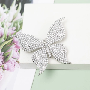 Elegant silver butterfly hair clip with white pearls and sparkling diamond accents