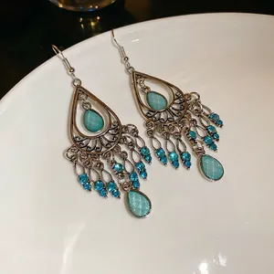 Bohemian silver drop tassel earrings with turquoise blue rhinestones and vintage filigree