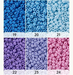 Close-up of 4mm glass seed beads in blue and purple shades for DIY jewelry making