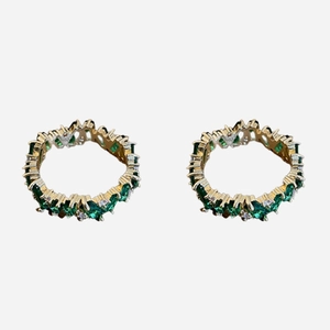 Gold plated irregular ring with green zircon stones in a stylish jagged design