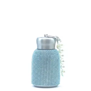Detail view of 300ml light blue rhinestone water bottle with pearl handle chain strap
