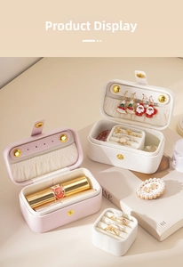 Close-up of portable PU leather jewelry box with compartments for rings and earrings