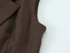 Close-up detail showing professional stitching and dark brown twill fabric texture
