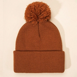 Kids warm caramel ribbed knit beanie with a large matching faux fur pom-pom topper