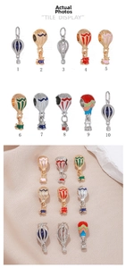 Detailed view of colorful enamel hot air balloon pendants for DIY jewelry making