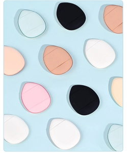 Macro shot of colorful mini finger powder puffs in triangle and teardrop shapes