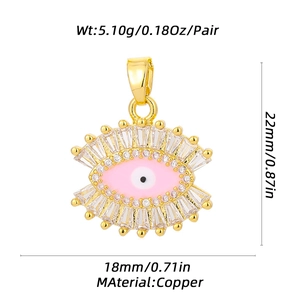 Golden copper evil eye pendant with pink enamel and zircons showing precise dimensions