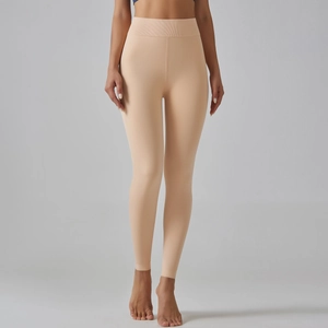 Close-up of high-waist elastic waistband on skin-tone thick thermal leggings