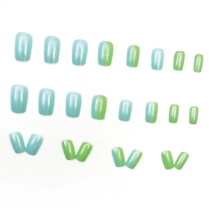 Blue and green gradient press-on nails set with glossy finish on white background