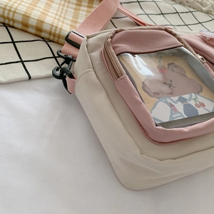 Cute beige canvas crossbody bag with pink accents and a transparent bear card pocket
