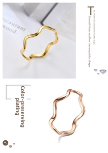Detailed macro view of wavy titanium steel rings in gold and rose gold with vacuum plating