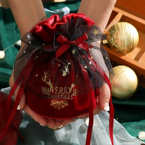 Red velvet Christmas gift drawstring bag with gold reindeer and Merry Christmas print