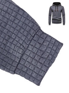 Detail of grey waffle knit fabric and ribbed cuffs on men's long sleeve hooded sweatshirt