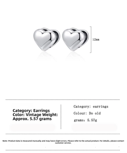 Detailed view showing 12mm heart hoop earrings dimensions and 5.57g weight specs