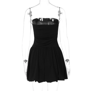 Detail view of the slim fit strapless black mini dress showing back waist tailoring