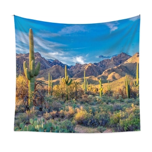 Bohemian desert tapestry featuring giant saguaro cacti and majestic mountains under blue sky