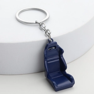 Detail of blue racing seat keychain with polished metal ring and durable alloy chain