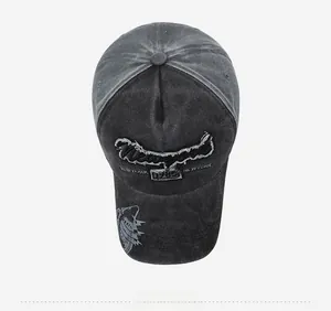 Macro view of washed cotton baseball cap with New York 1985 embroidery and shark detail