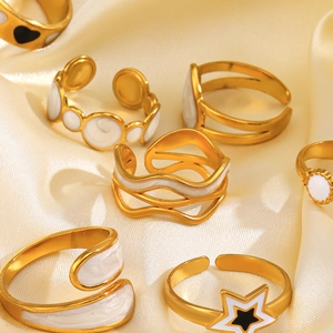 Chic gold-plated stainless steel star and heart enamel ring set on beige satin