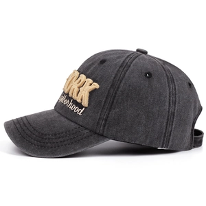 Vintage washed black baseball cap featuring yellow WORK 3D embroidery and white lettering