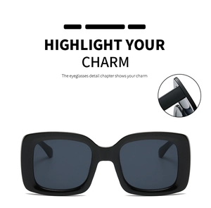Detail of square black frame sunglasses showing the durable hinge and premium dark lenses