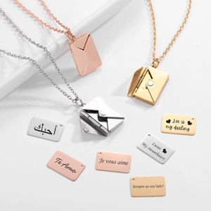 Three envelope necklaces in silver, gold, and rose gold with custom engraved love letters
